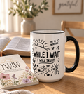 While I Wait, I Will Trust mug in black with the While I Wait journal and open Bible