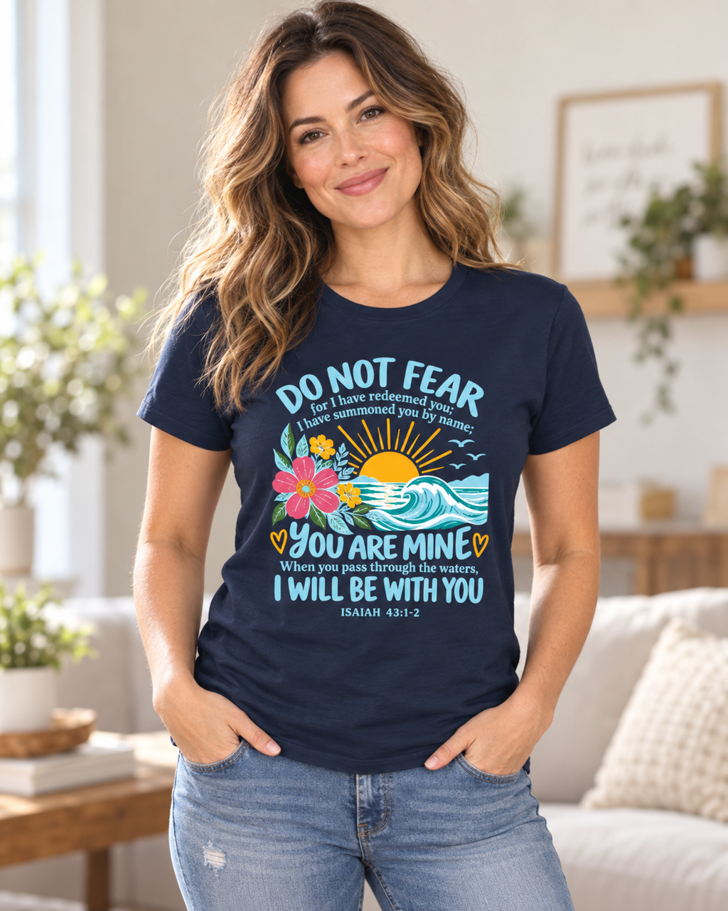 Woman wearing the navy Do Not Fear Isaiah 43:1-2 tee at home