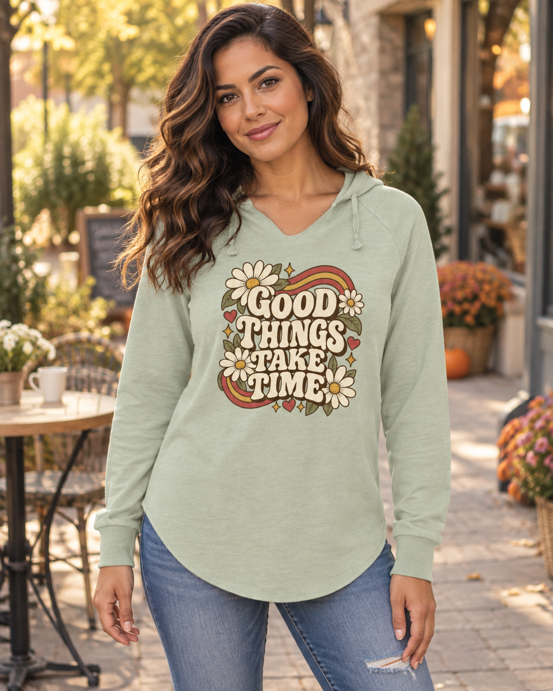 Woman wearing the Sage Good Things Take Time wave wash hoodie outdoors