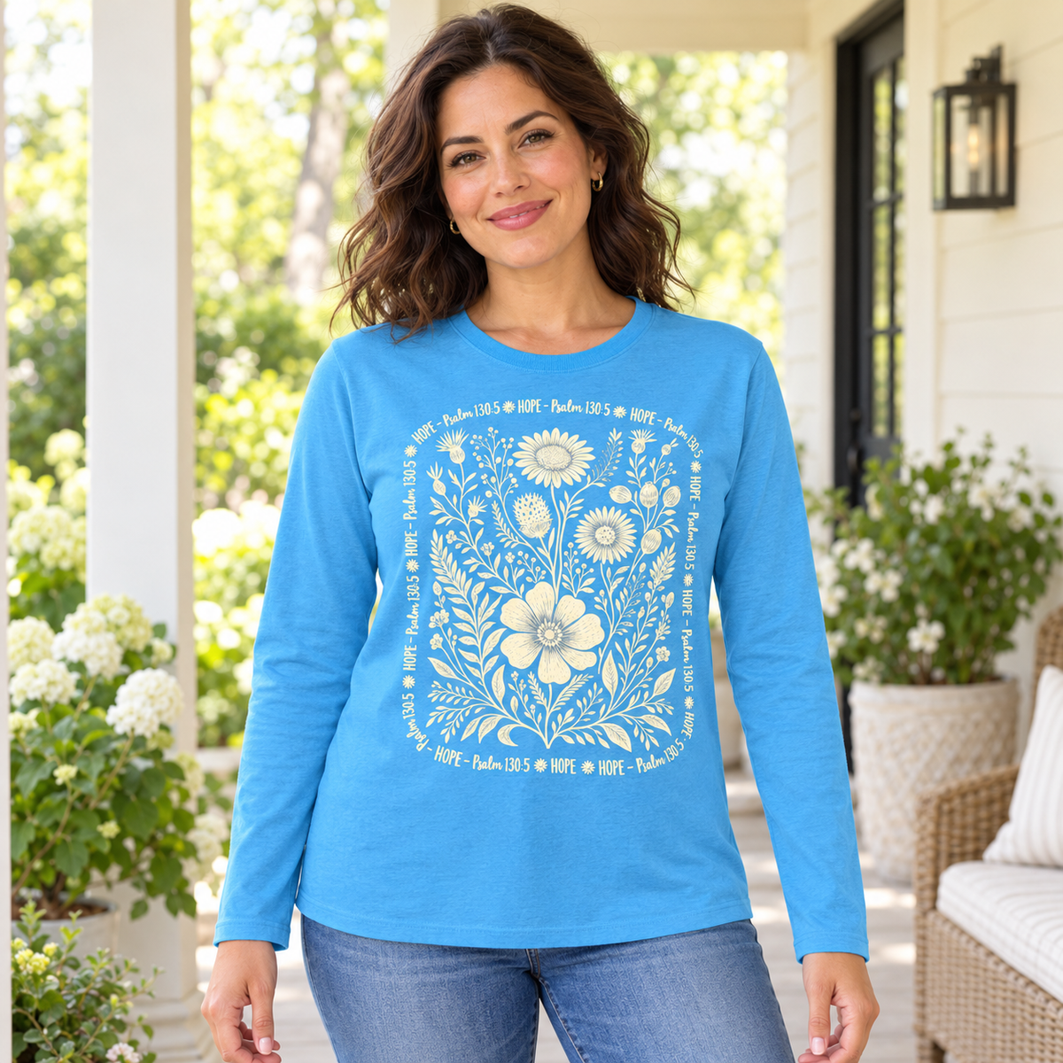 Woman wearing the Aquatic Blue Hope Psalm 130:5 floral long sleeve tee