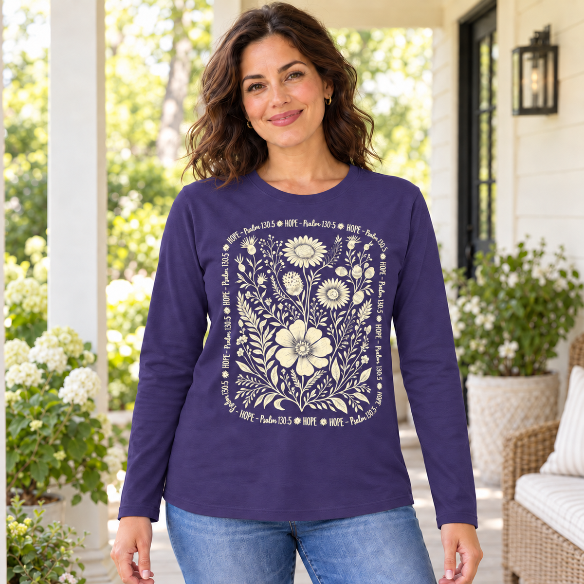 Woman wearing the Purple Hope Psalm 130:5 floral long sleeve tee on a porch