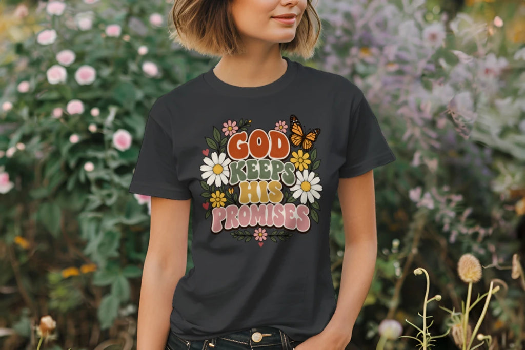 Woman wearing the Charcoal God Keeps His Promises tee in a garden