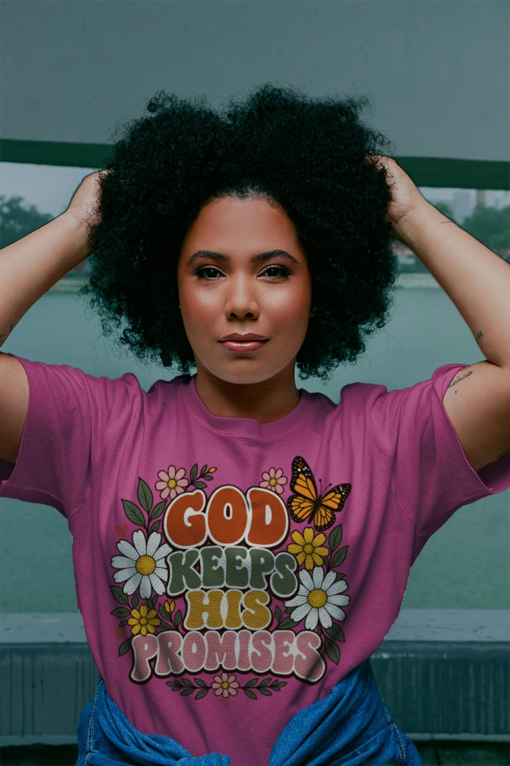 Woman wearing the Sangria God Keeps His Promises tee with butterfly and daisy design