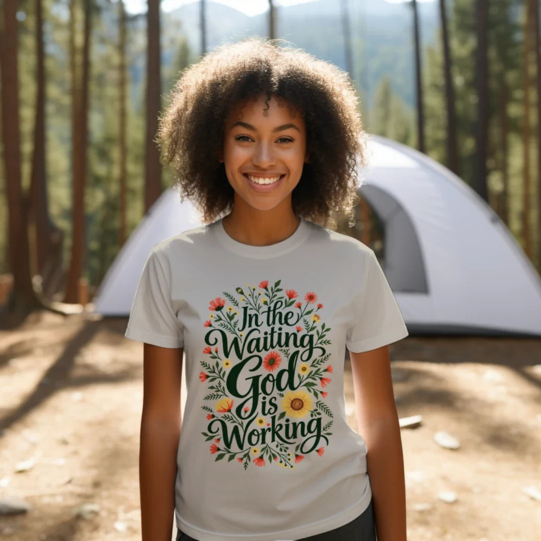 Woman wearing the In the Waiting, God Is Working floral tee