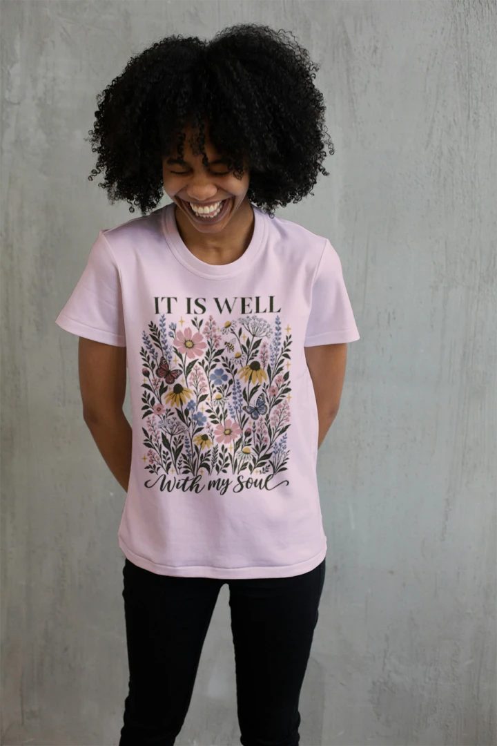 Woman wearing the Soft Pink It Is Well With My Soul floral tee
