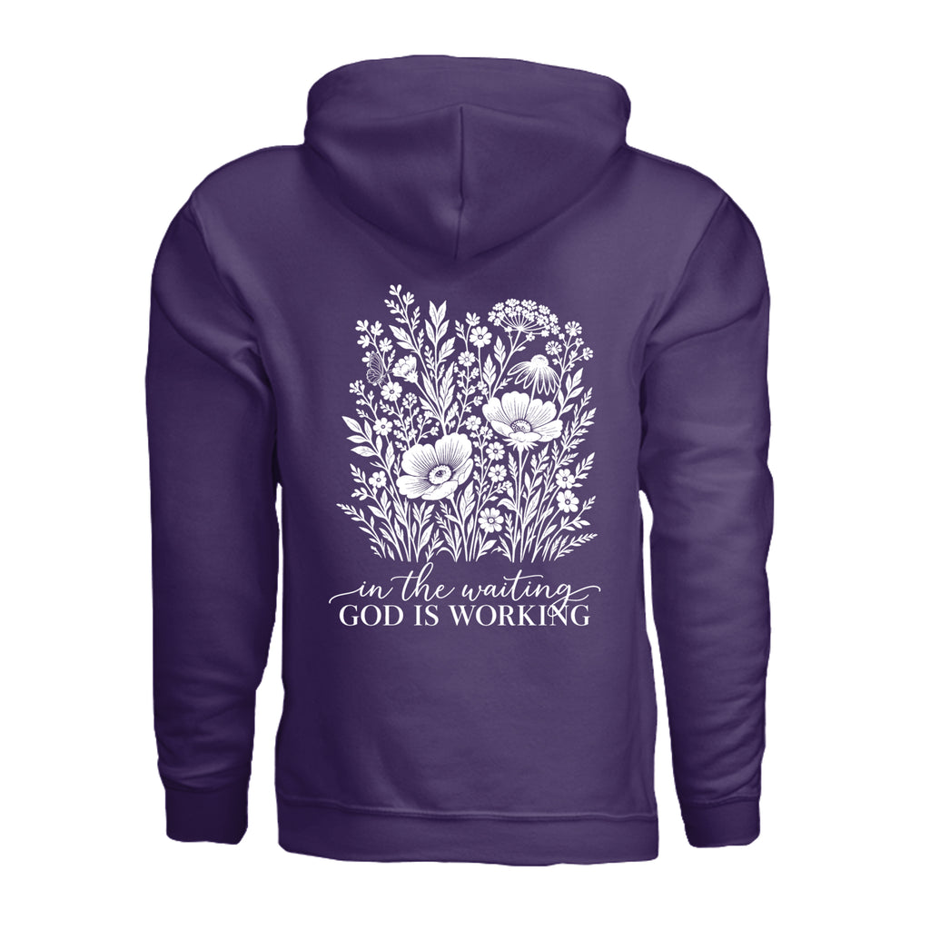 In the Waiting, God Is Working floral hoodie in Purple, back view with the full wildflower and message design